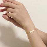 Le Loup Piggy Bracelet Gold with Red Line